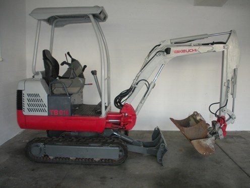 Mini pelle sur chenille caoutchouc