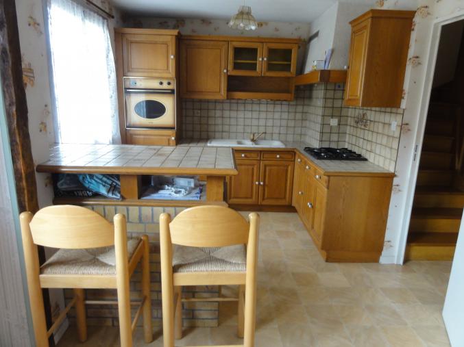 Maison de ville mitoyenne avec petit terrain à Besançon