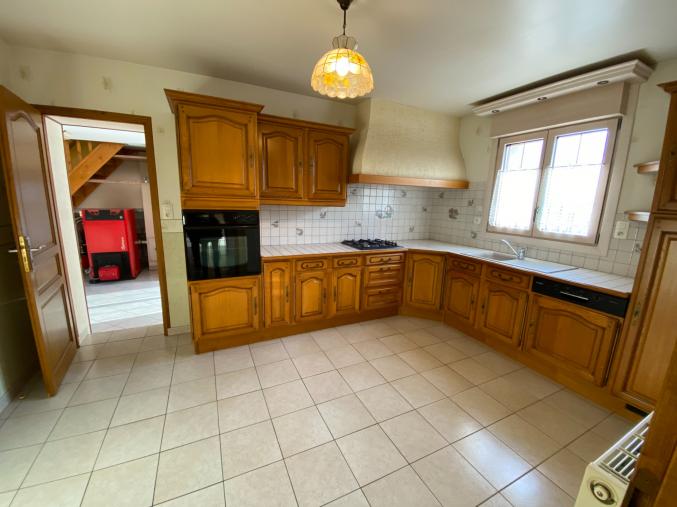 Maison composée au rez-de-chaussée d'une entrée